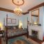 Interior photo of a classically decorated room with crystal chandelier and marble fireplace