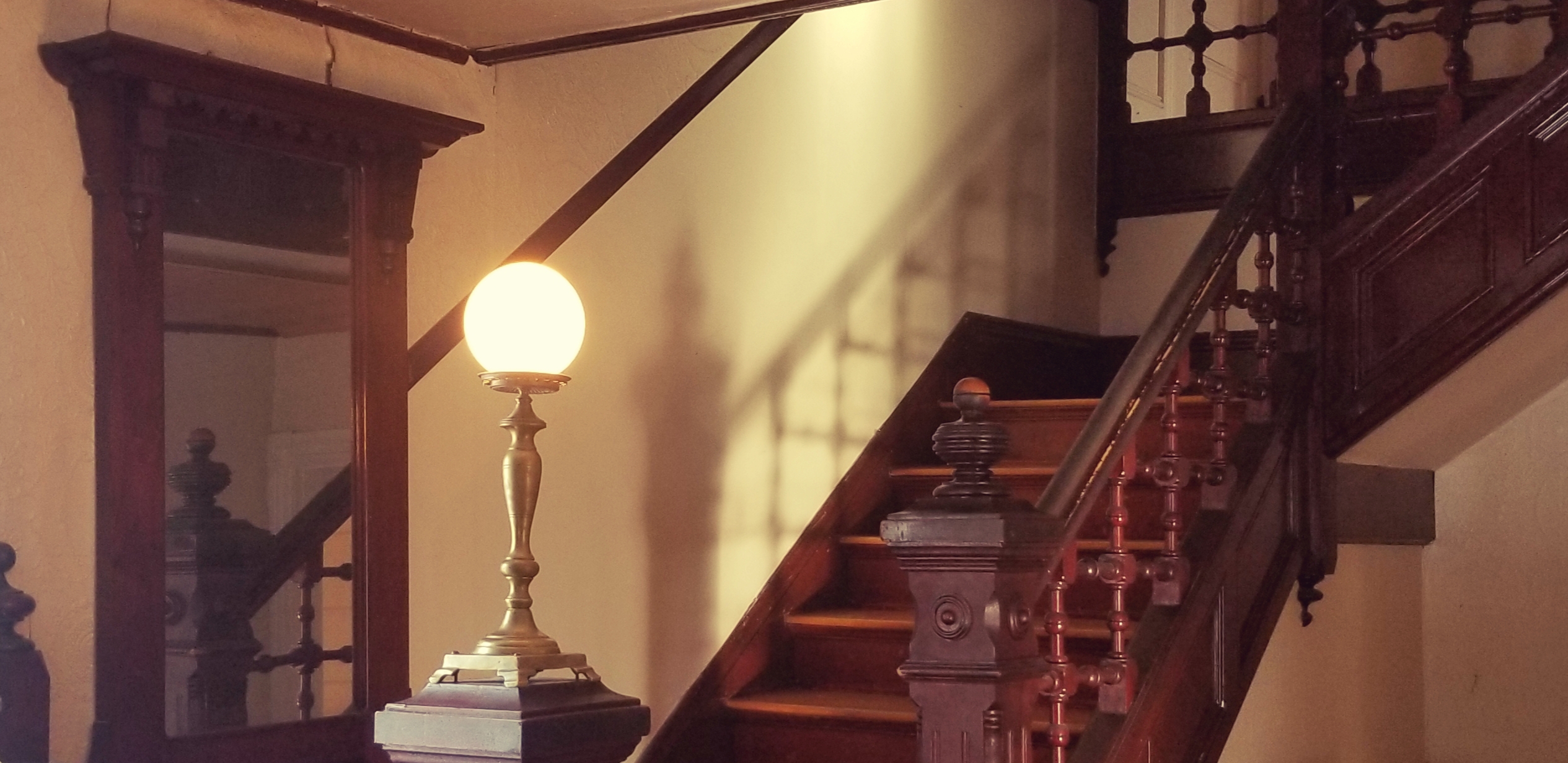 Interior Stairway with frosted glass globe light fixture